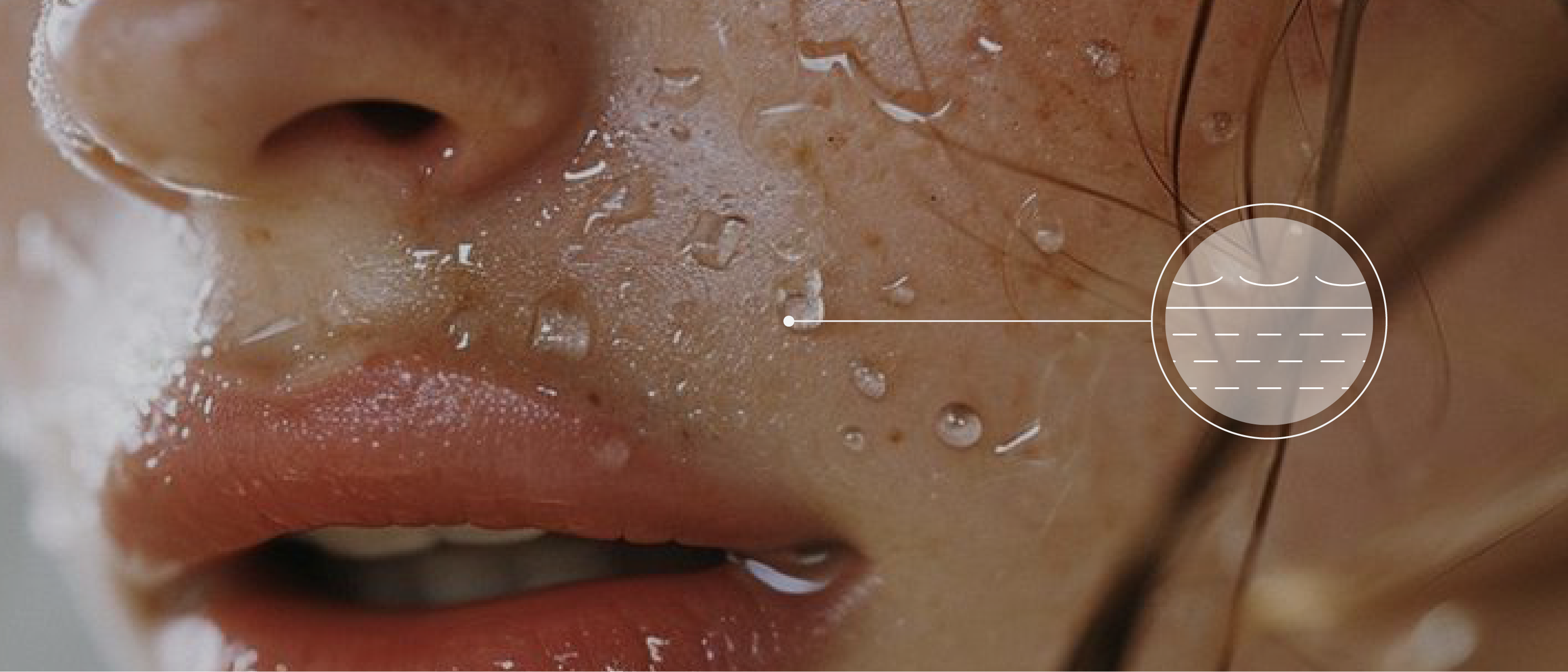 Close-up of a persons face with water droplets on their skin. The image highlights the moisture on the cheek and lips. An overlaid info-icon graphic shows a circular icon with wavy lines, representing hydration and moisture.