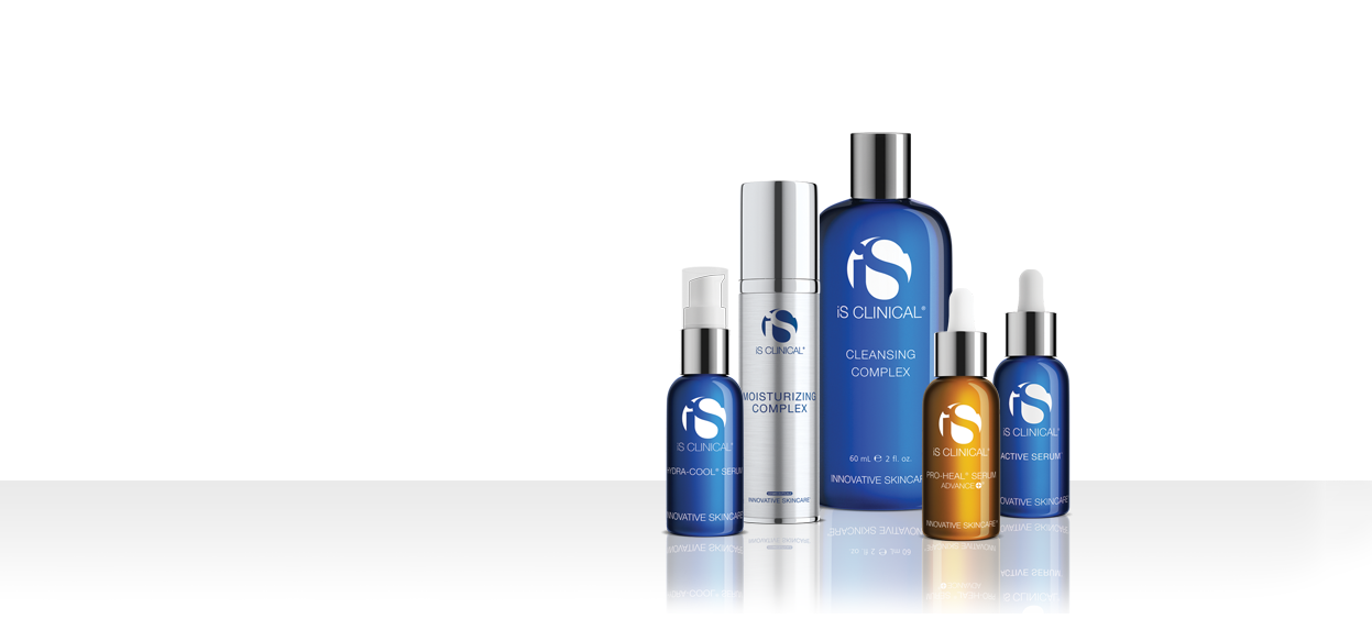 A group of iS Clinical skincare products, including bottles and jars of various sizes in blue, silver, and amber packaging, arranged on a reflective surface against a white background.