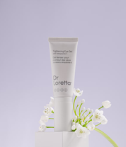 Dr. Loretta Tightening Eye Gel 20ml lifestyle shot of product and flowers image