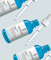La Roche-Posay Hyalu B5 serum bottles with droppers on a light blue background