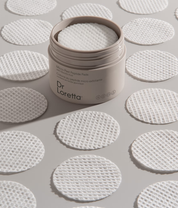Dr. Loretta Micro Peel Peptide Pads lifestyle image with product and pads