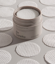 Dr. Loretta Micro Peel Peptide Pads lifestyle image with product and pads close up