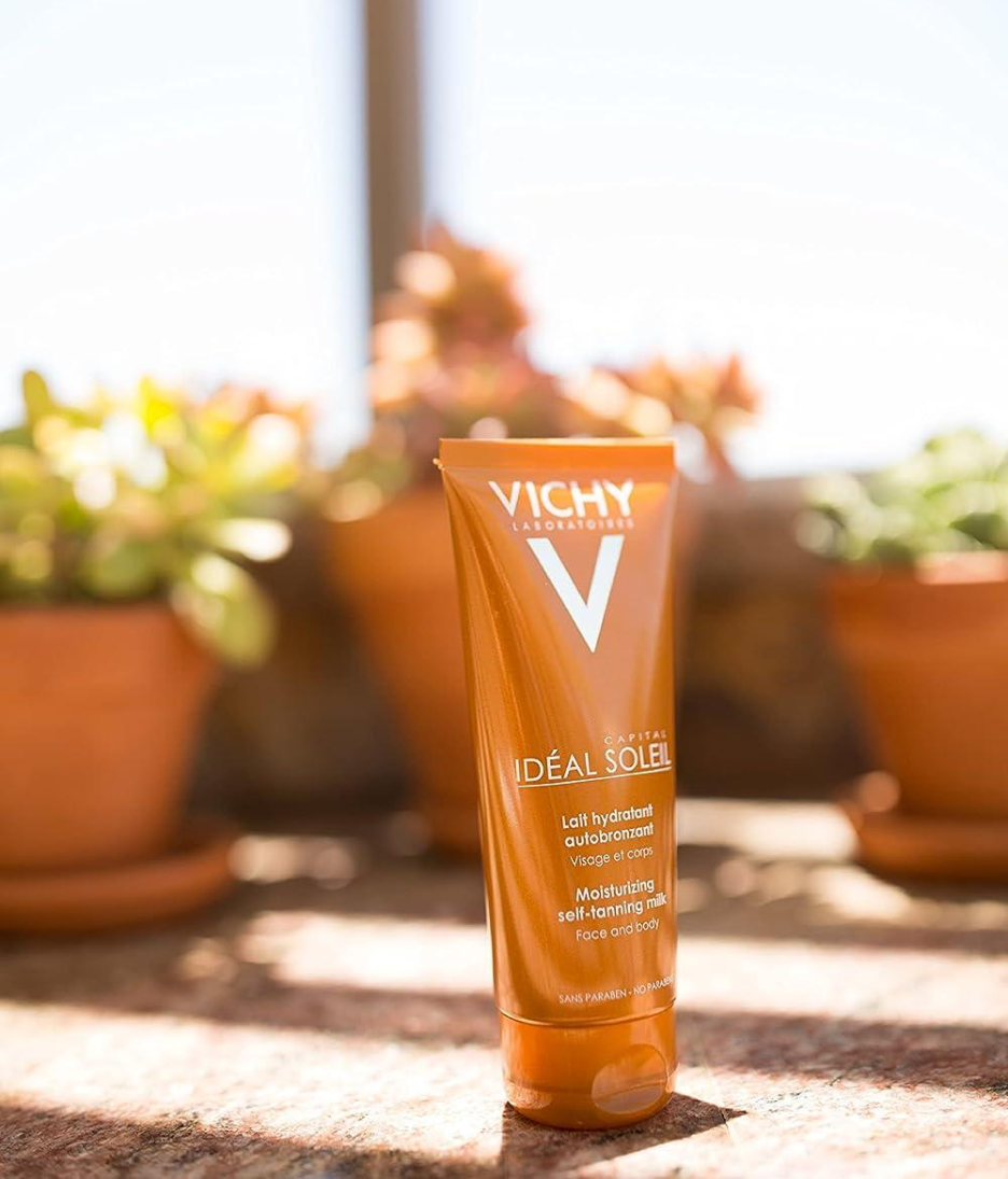 Vichy Capital Soleil Moisturising Self-Tanning Milk face body product shot with lifestyle background